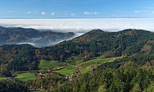 The Black Forest is a large forested mountain range in the state of Baden-Württemberg in southwest Germany, bounded by the Rhine Valley to the west and south and close to the borders with France and Switzerland.