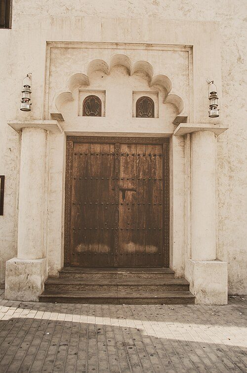 An old door in Sharjah, displaying the historical architecture of the city.