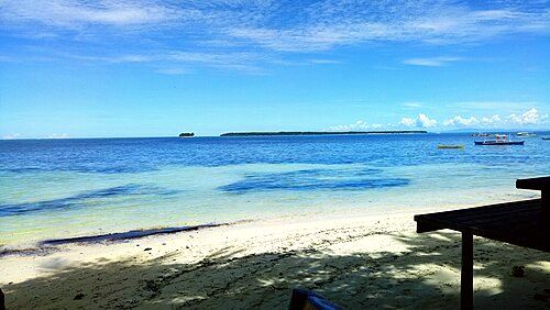 Guyam Island (left) and Daku Island (right) visible from the beach at General Luna