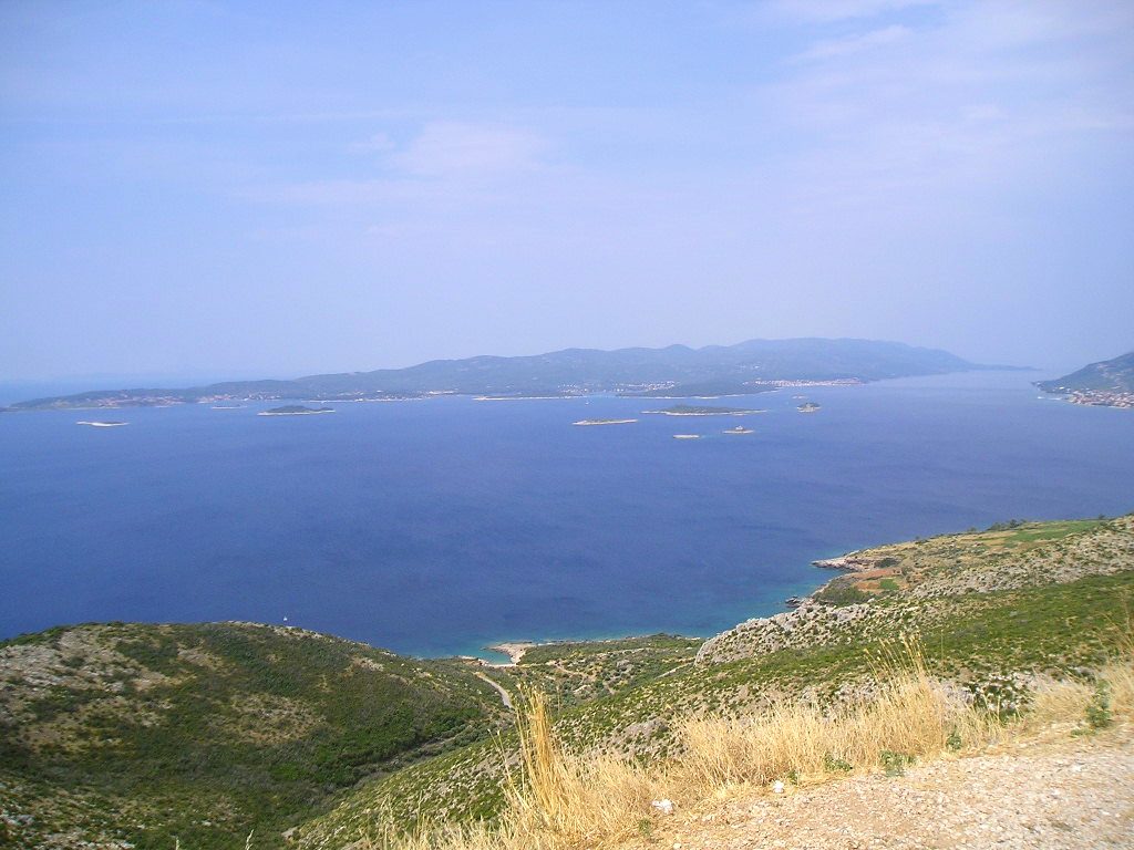 A panoramic view of the easternmost parts of Korčula, with Lumbarda, City of Korčula and Orebić (Pelješac) from left to right