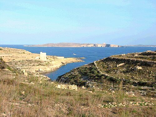 View of Mġarr ix-Xini, with Comino and mainland Malta in the background.
