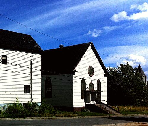 The former Congregation Sons of Israel synagogue, in Glace Bay. In 1902, the synagogue was Nova Scotia's first purpose-built synagogue. It permanently closed in July 2010. To the left is the also closed Talmud Torah community centre. This was the loc