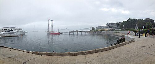 The four-masted schooner Margaret Todd. Bald Porcupine Island is beyond the pier and the Bar Harbor Inn is to the right.